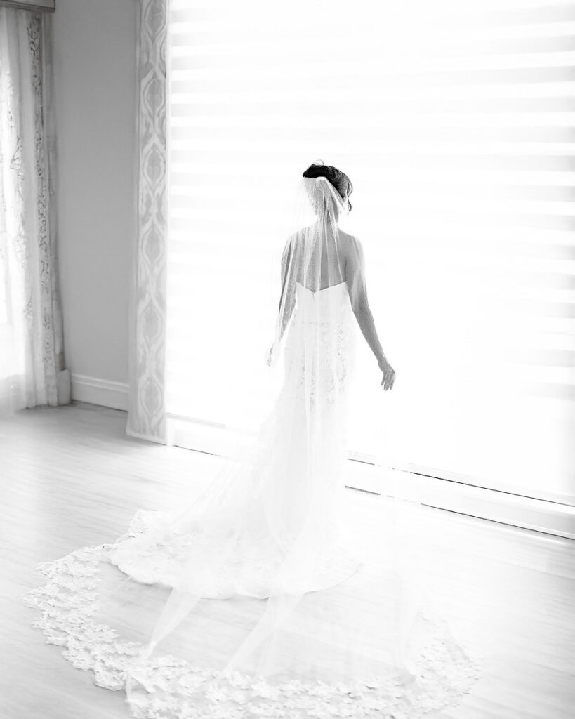 High-key bridal portrait with bright window light in the bridal suite at Giorgio’s on Long Island.
