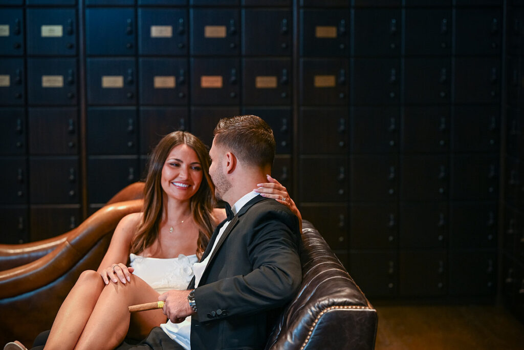 Engaged couple posing romantically at the bar inside The Lannin in Eisenhower Park, stylish portrait.