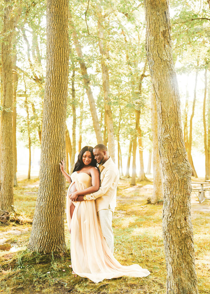 maternity photography couple portrait in trees with soft natural light Planting Fields