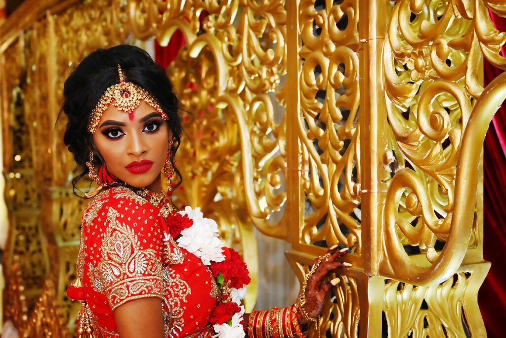 Close-up portrait of a South Asian bride wearing Ferriani design at Crest Hollow Country Club, showing intricate bridal details.