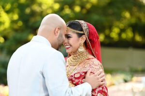 South Asian bride and groom nose to nose at Crest Hollow Country Club in Woodbury, NY