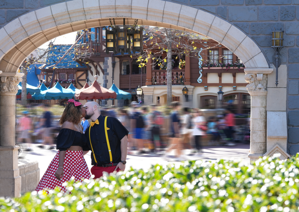 romantic Magic Kingdom engagement session photo in front of Cinderella Castle at Walt Disney World