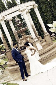 South Asian bride and groom holding hands at Sand Castle wedding venue in Franklin Square, NY