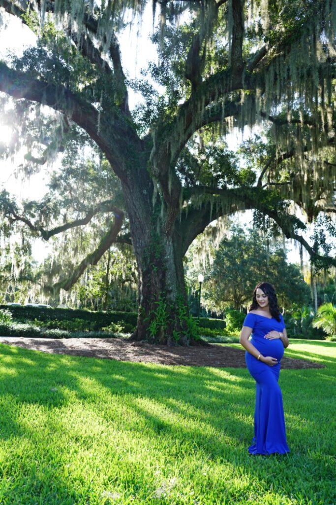Doug Gordon of Patken Photographer capturing a maternity session in Winter Park, Florida under an oak tree