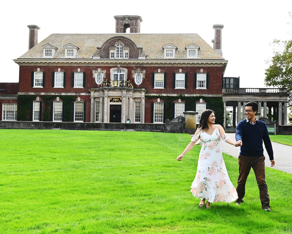 Old Westbury Gardens wedding photographer capturing bride and groom on mansion lawn