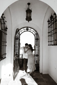 Engaged couple photographed during an engagement session at the Vanderbilt Museum on Long Island