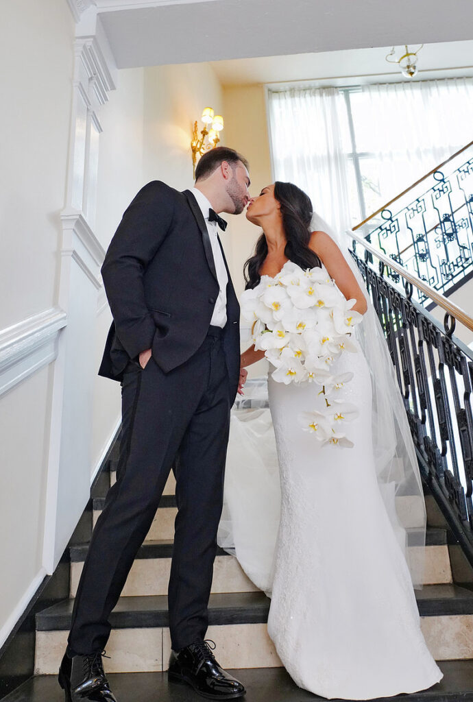 Fashionable editorial bride and groom portraits on the staircase at The Lannin wedding venue on Long Island