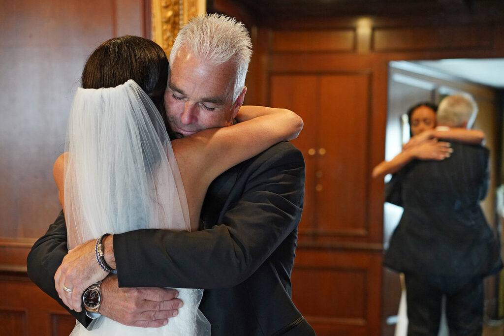 Tearful Dad and Daughter First Look photo at wedding venue