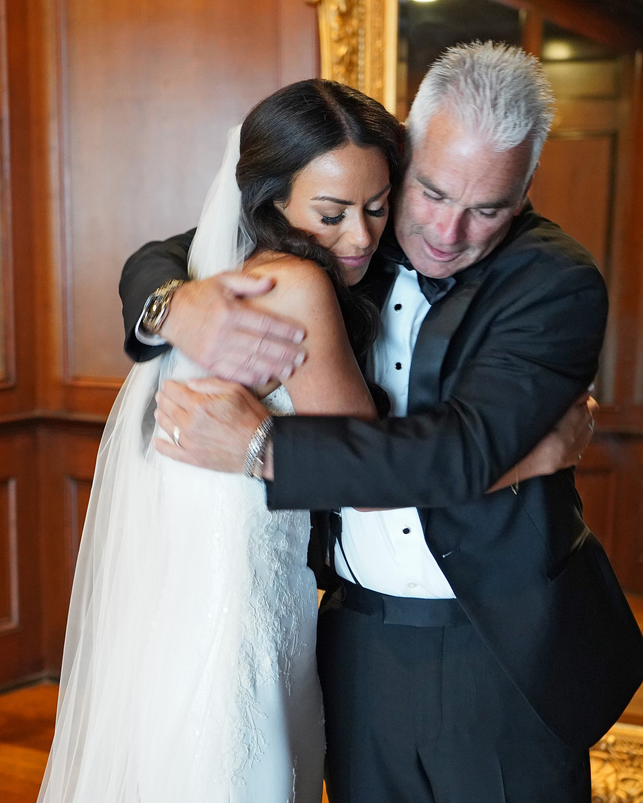 bride and dad hugging during Dad and Daughter First Look wedding moment
