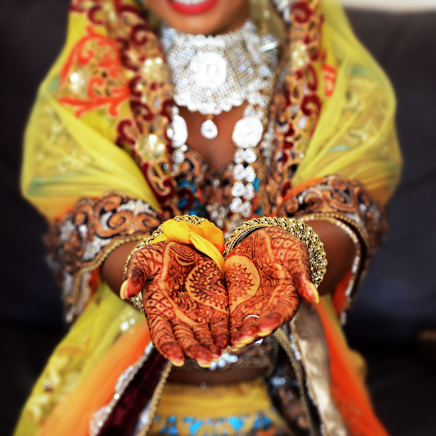 Hands With Henna | Mehndi Details Wedding Photography Close-up of hands with henna showing intricate mehndi designs on wedding day.