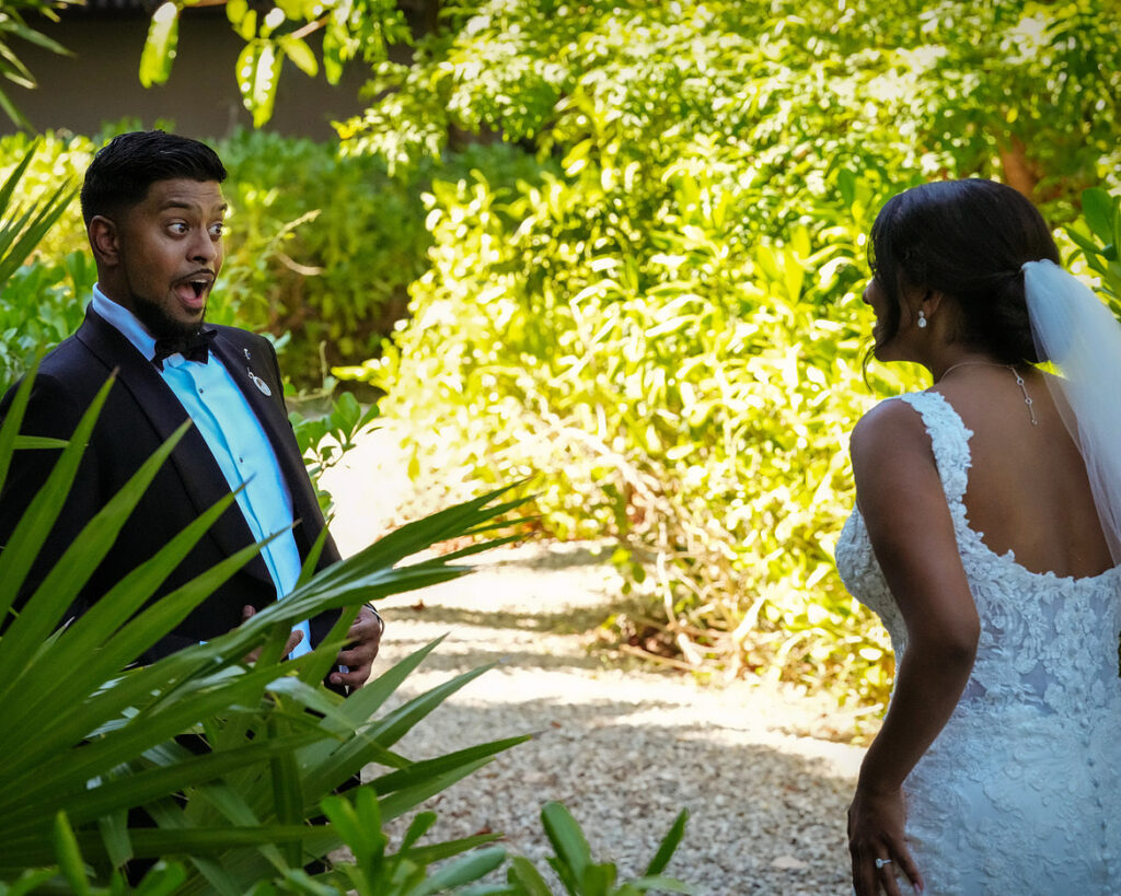 storytelling wedding photography of groom surprised reaction during first look moment