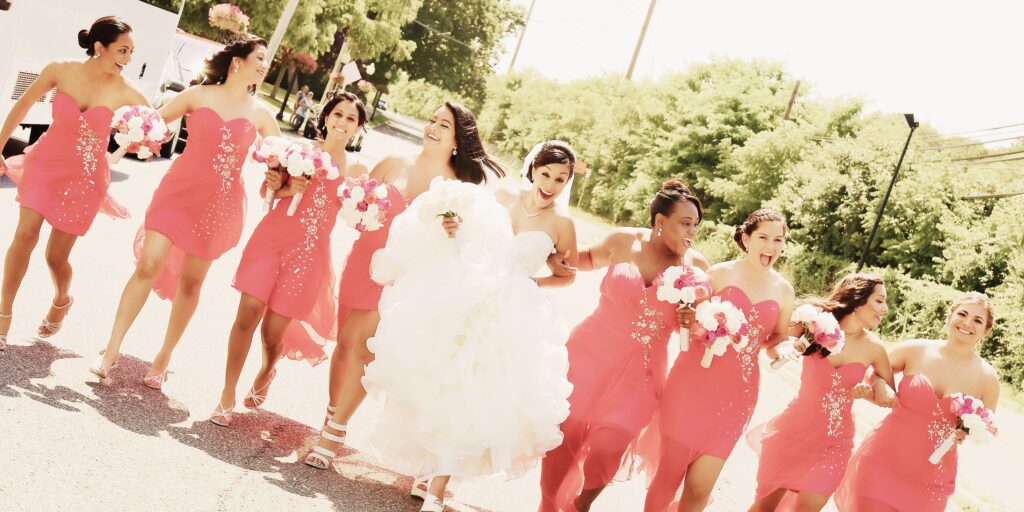 storytelling wedding photography of bridal party walking outdoors with artistic motion blur