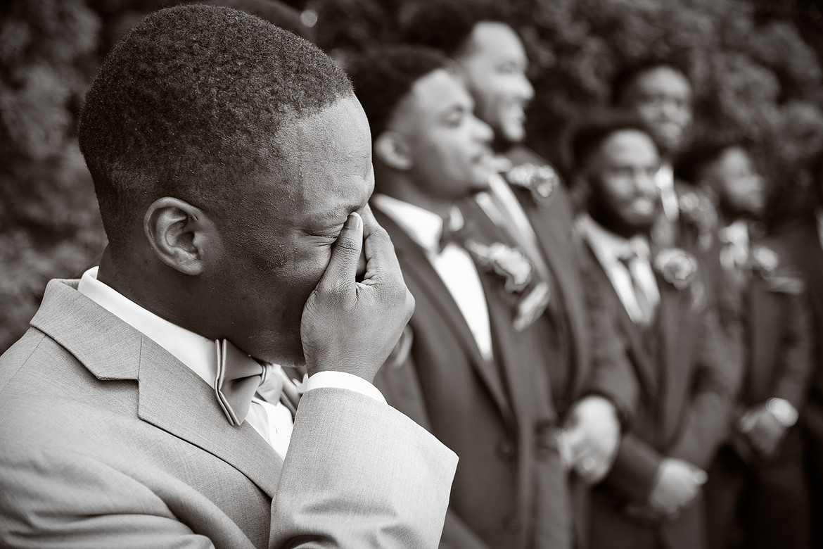 Groom Emotional Reaction in Black and White storytelling wedding photography of groom crying emotional reaction during wedding ceremony