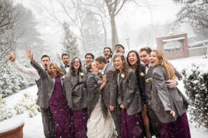 bridal party in the snow at Westbury Manor winter wedding on Long Island Wedding Venues