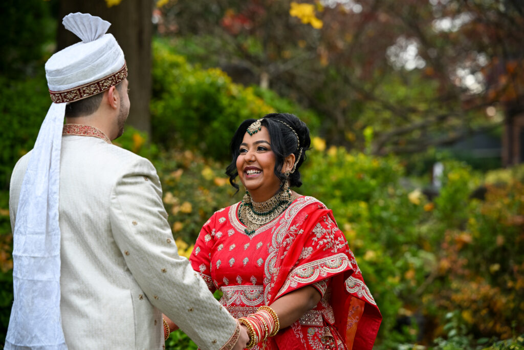 South Asian bride smiling during ceremony at Westbury Manor Long Island