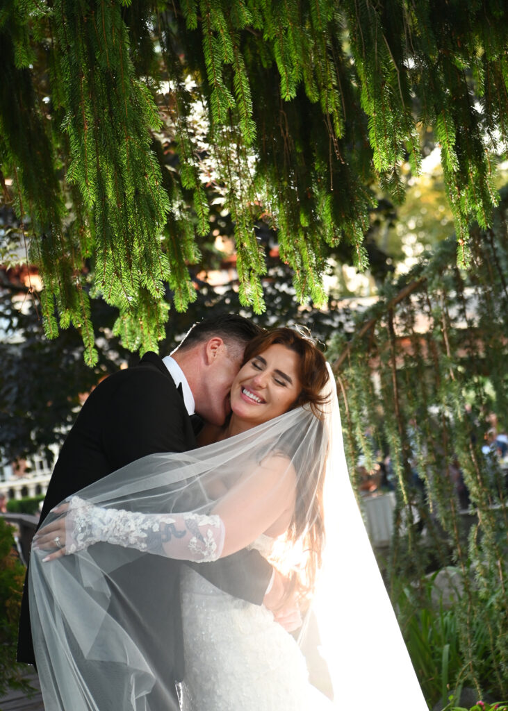 Bride and groom walking together on Westbury Manor grounds Long Island