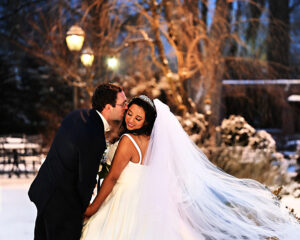 Westbury-manor-snowy-winter wedding-bride-and-groom-kissing