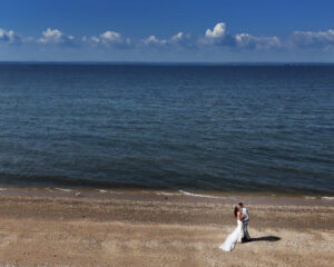 Drone beach wedding portrait at Crescent Beach Club in Long Island New York photographed by Doug Gordon of Patken Photographer