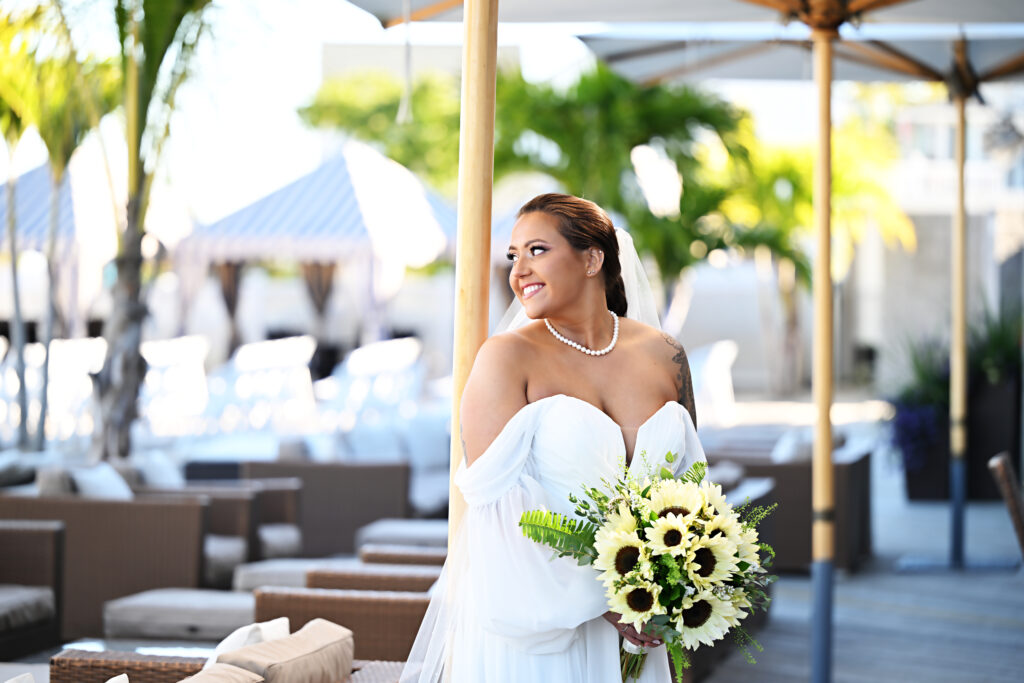 Bride holding bouquet on the deck at Crescent Beach Club wedding Long Island New York
