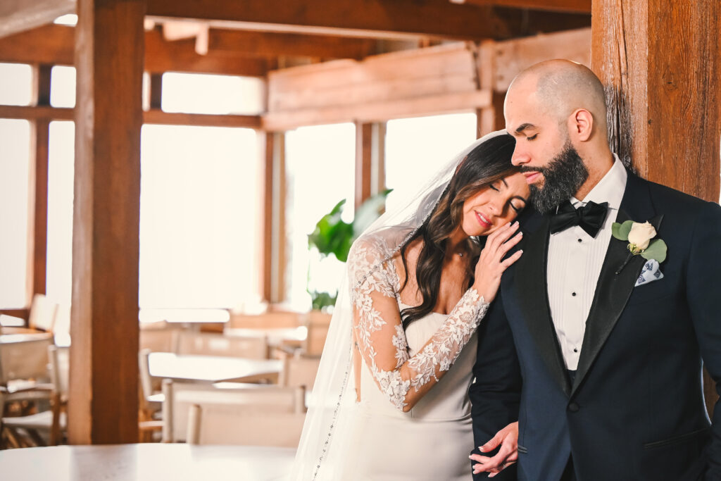 Bride leaning into groom for intimate portrait indoors at Crescent Beach Club Long Island New York