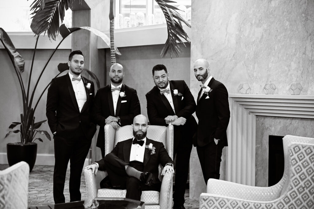 Black and white groomsmen group portrait at Crescent Beach Club Long Island New York