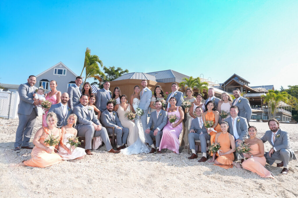 Large wedding group photo on the beach at Crescent Beach Club Long Island New York