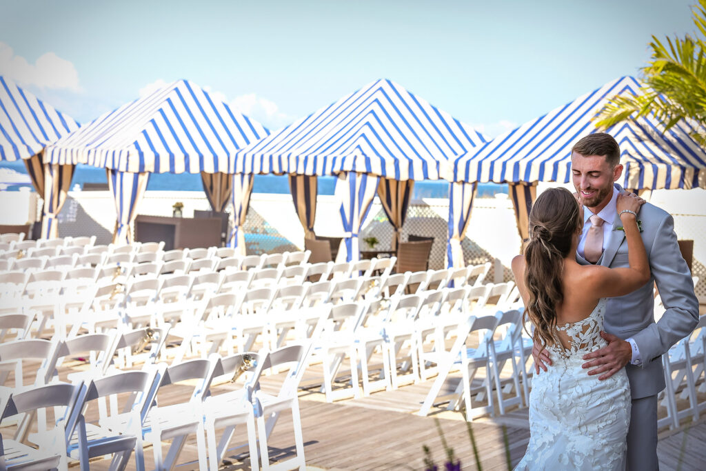 Beach ceremony seating with Bride and Groom First reveal striped cabanas at Crescent Beach Club wedding Long Island New York