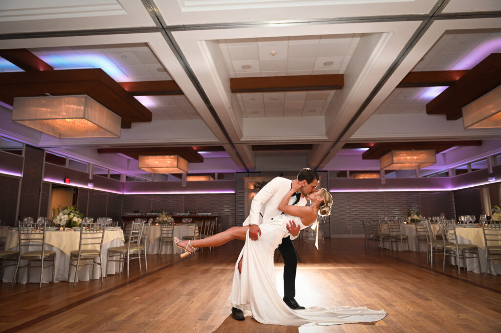 Bride and groom first dance dip in the ballroom at Crescent Beach Club, Long Island, New York.