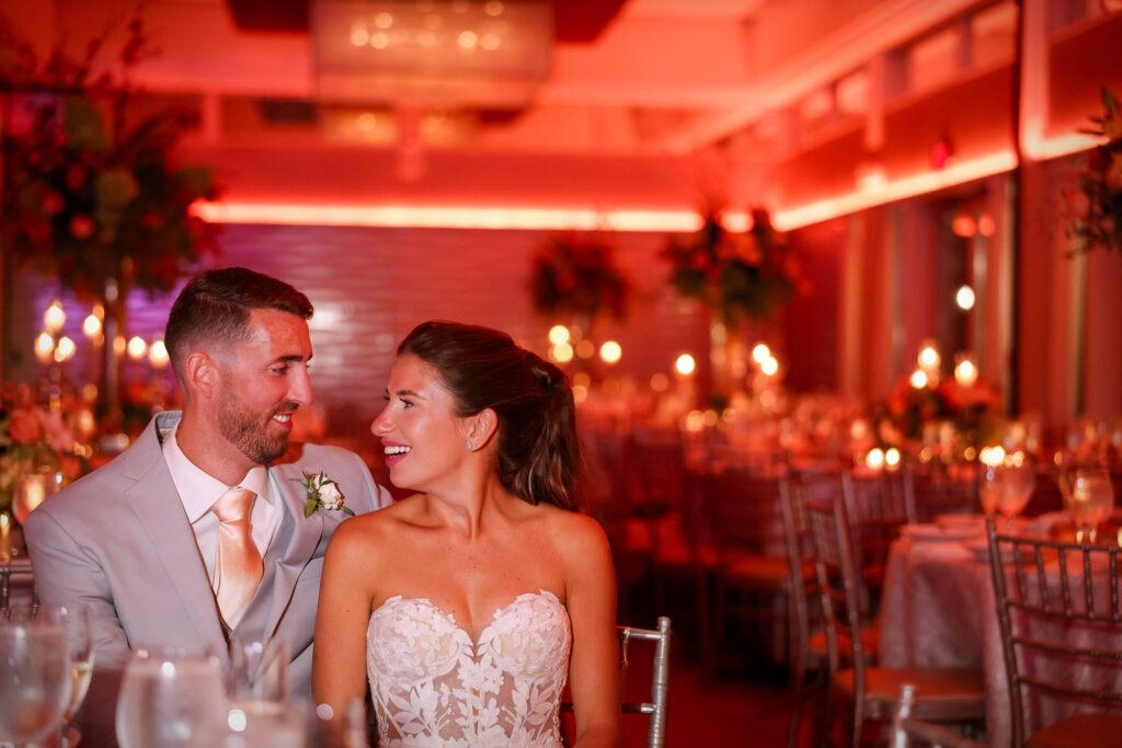 Crescent Beach Club wedding photo at Bayville, Long Island, New York: crescent beach club wedding reception candid couple laughing. Photo by Doug Gordon | Patken Photographer.