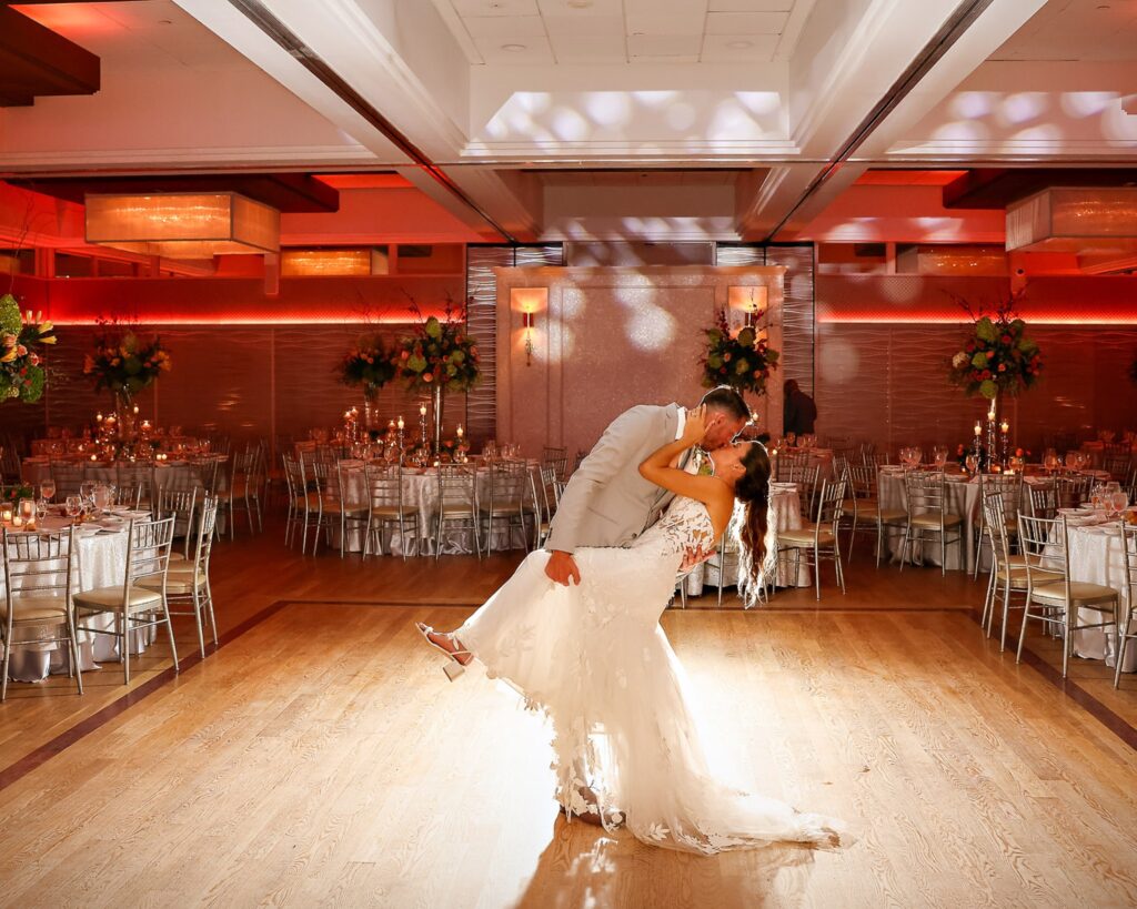Crescent Beach Club wedding photo at Bayville, Long Island, New York: crescent beach club wedding reception first dance dip. Photo by Doug Gordon | Patken Photographer.