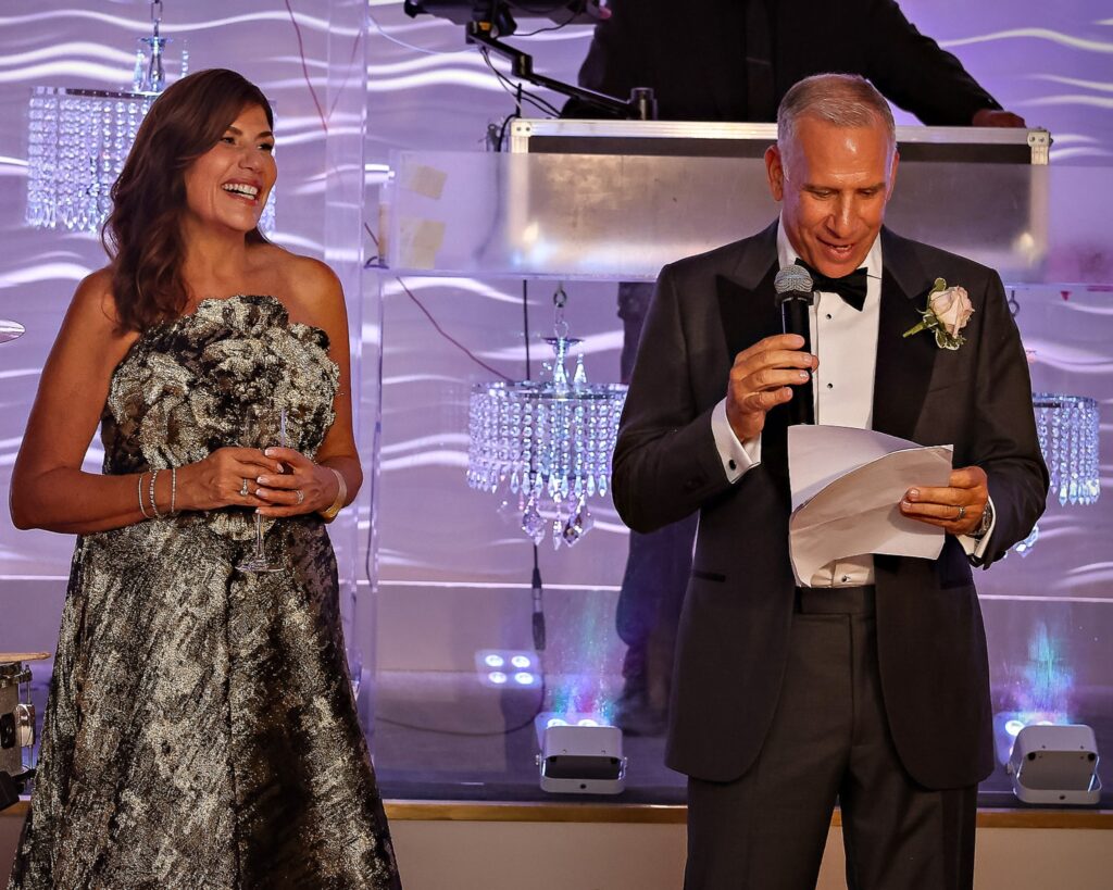 Crescent Beach Club wedding photo at Bayville, Long Island, New York: crescent beach club wedding toasts speech on stage. Photo by Doug Gordon | Patken Photographer.