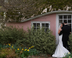 Bride and groom portrait at the Pink Cottage at Planting Fields Arboretum in Oyster Bay, NY