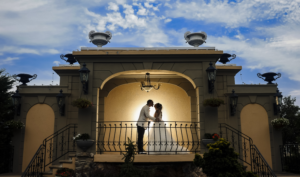 Bride and groom portrait on the outdoor bridge at Jericho Terrace in Mineola, NY