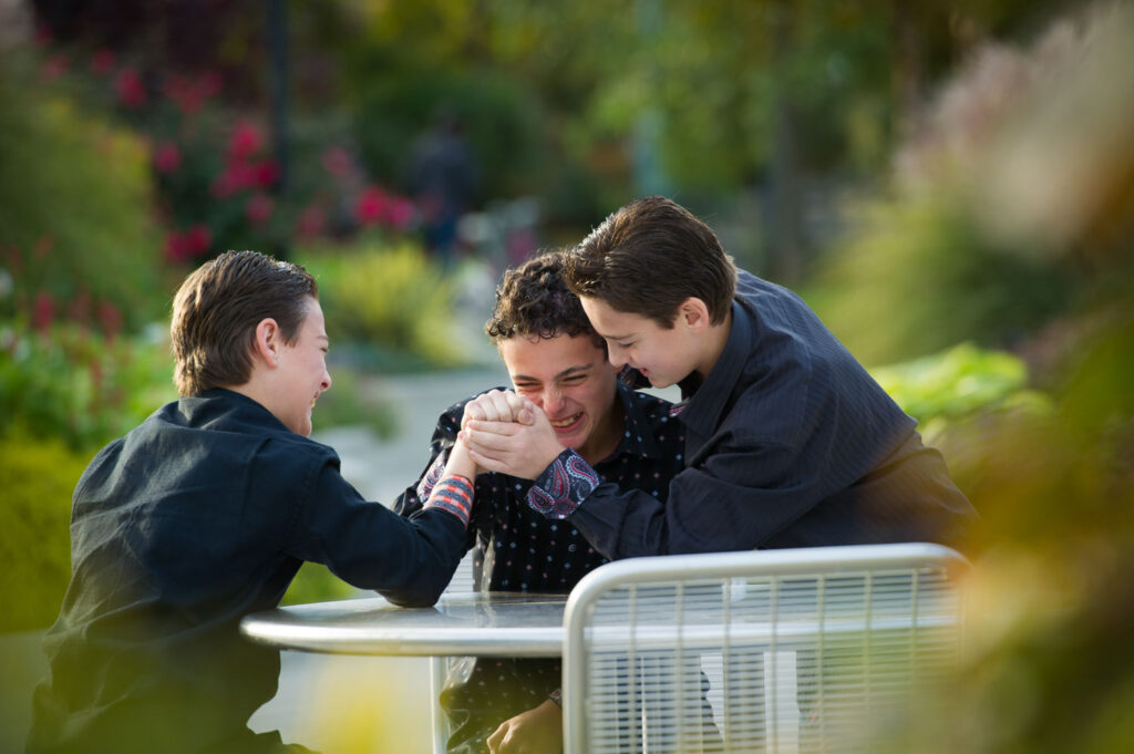 Playful brother having fun, captured in a candid moment full of energy and laughter.