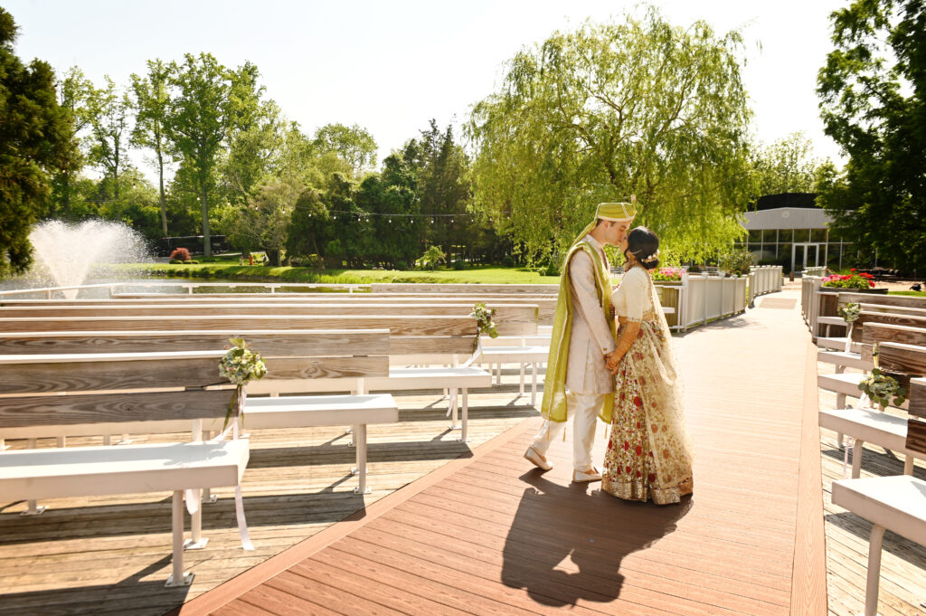 Bride and groom walking near ceremony space at Flowerfield St. James