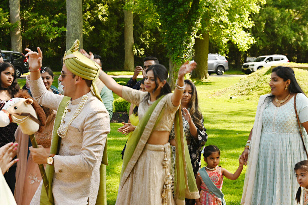 Indian bride and groom celebrating outdoors at Flowerfield wedding