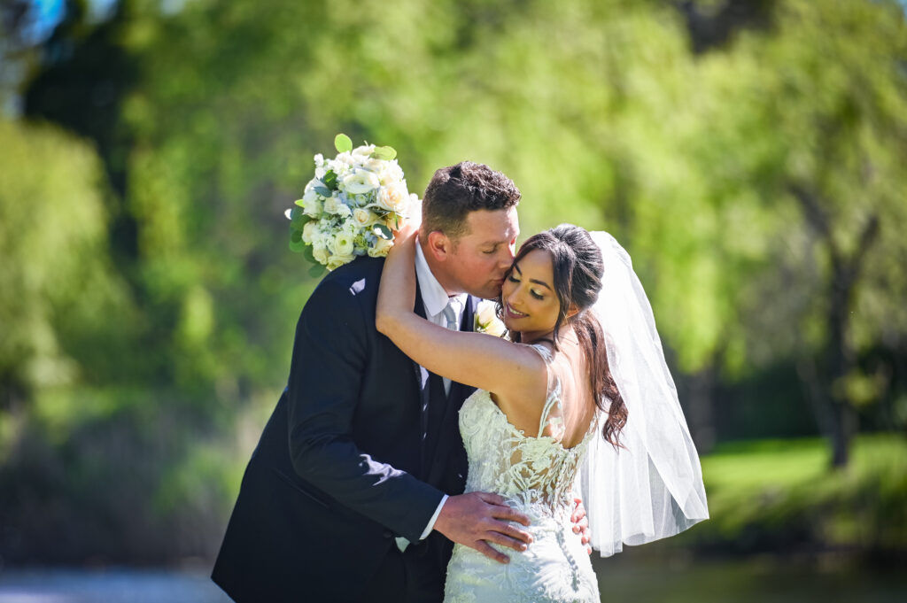Bride and groom romantic garden portrait at Flowerfield wedding venue