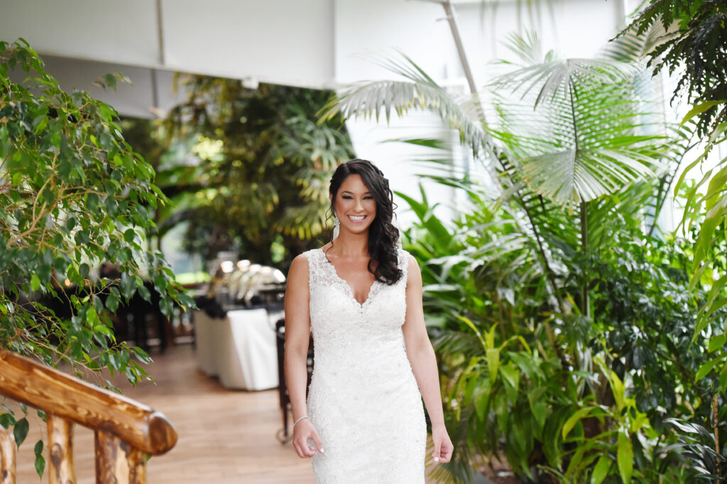 Bride getting ready inside Flowerfield conservatory Long Island