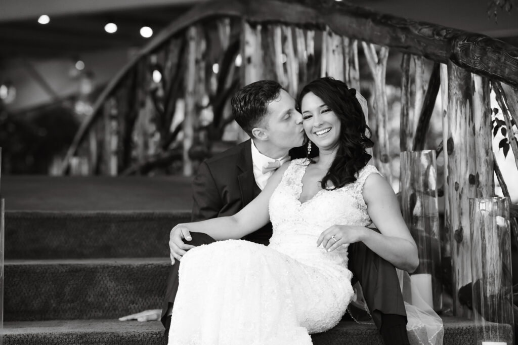 Black and white romantic portrait on bridge at Flowerfield wedding