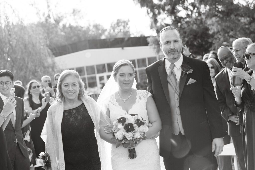 Black and white family portrait at Flowerfield wedding venue