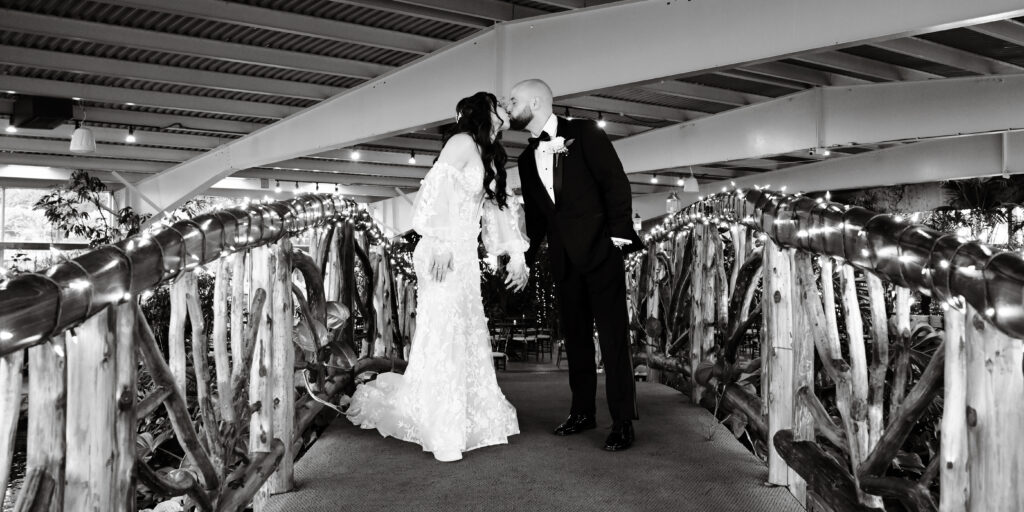 Black and white full length wedding portrait inside Flowerfield