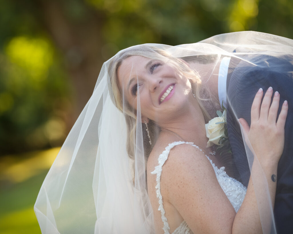 Bride smiling portrait in natural light at Flowerfield