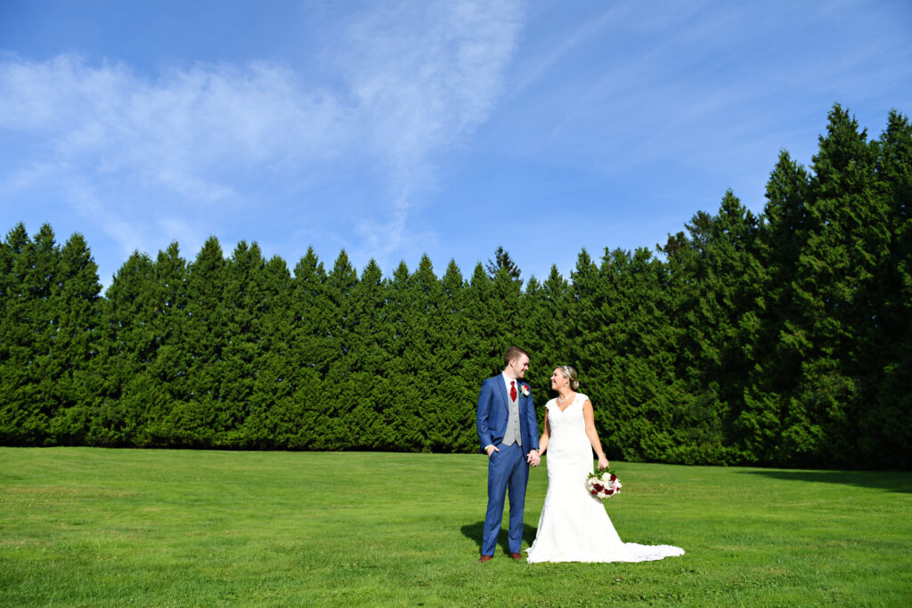 Bride and groom portrait in open field at Flowerfield St. James