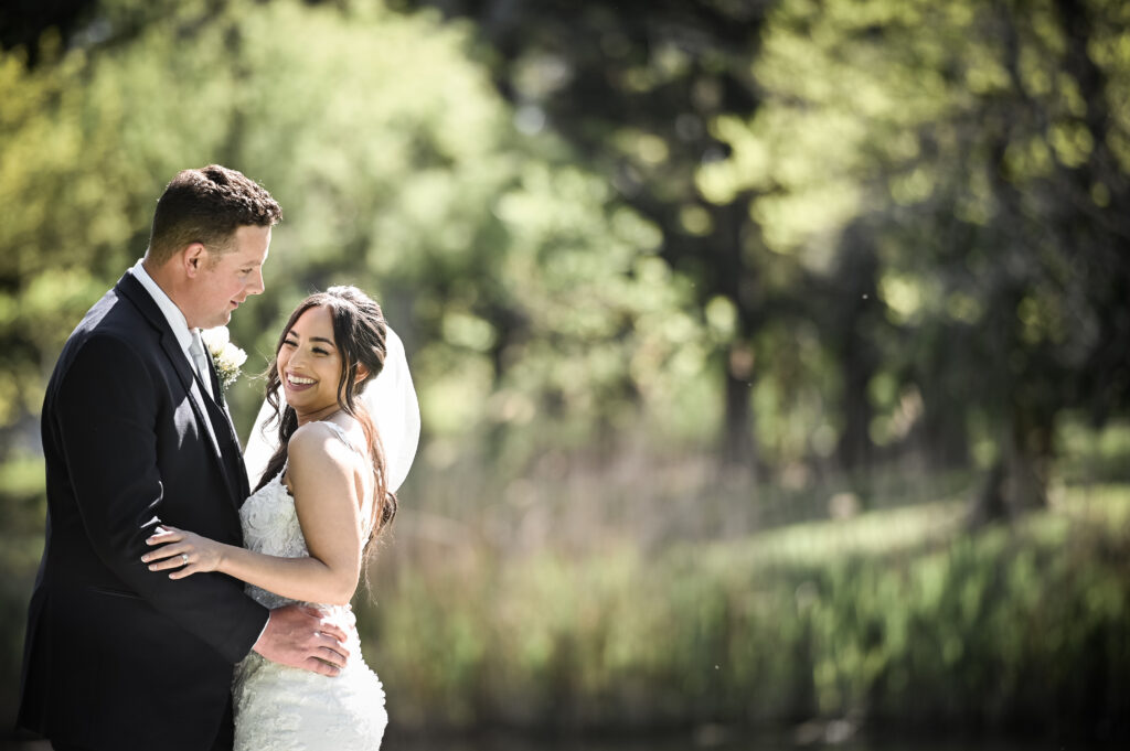 Romantic candid moment in garden at Flowerfield wedding venue