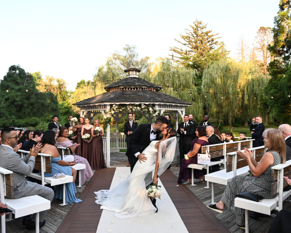 Bride walking down aisle at Flowerfield outdoor ceremony