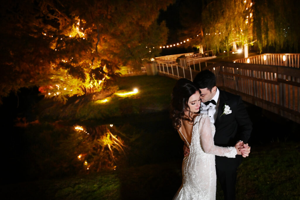 Nighttime romantic portrait with firelight at Flowerfield