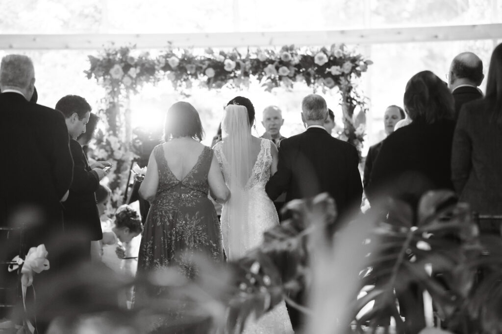 Black and white ceremony aisle moment at Flowerfield wedding