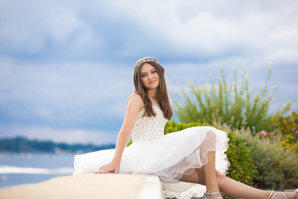 Outdoor Sweet 16 portrait captured on Long Island, featuring natural light and an elegant celebratory moment.