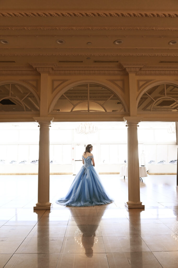 Sweet 16 ballroom gown portrait captured in Central Park, featuring elegant styling and a timeless New York setting.