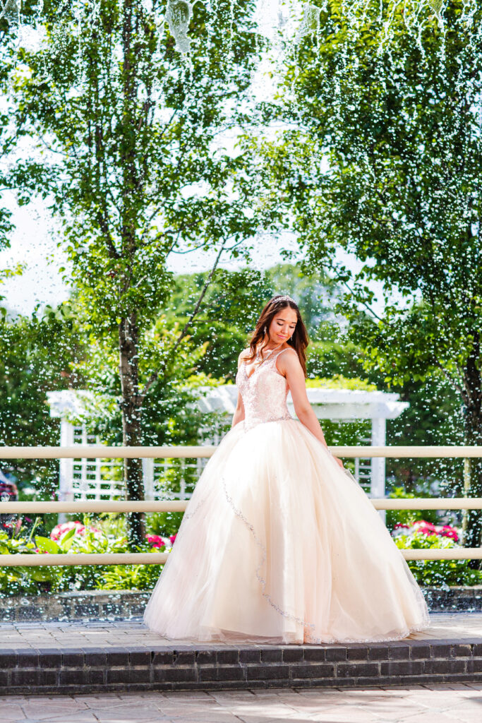 Sweet 16 garden princess portrait captured in New York, featuring an elegant gown, soft natural light, and a romantic garden setting.